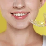 A-patient-holding-Invisalign-in-Matthews-NC