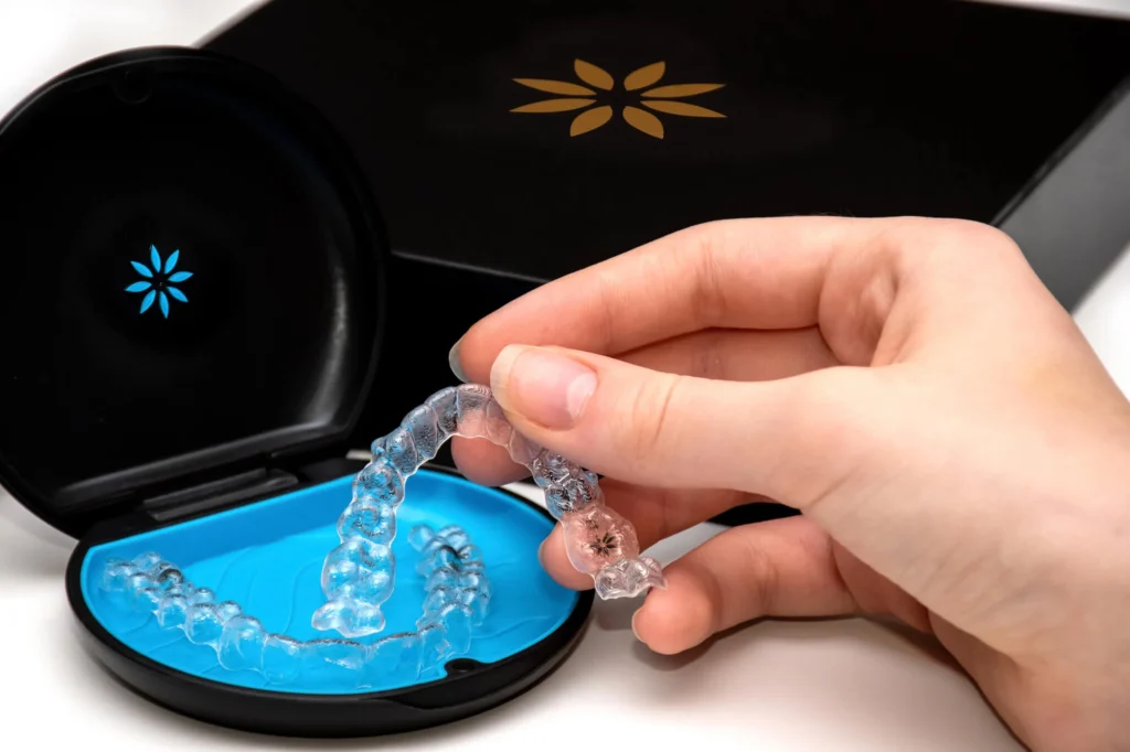 Patient-holding-Invisalign-in-Matthews-NC