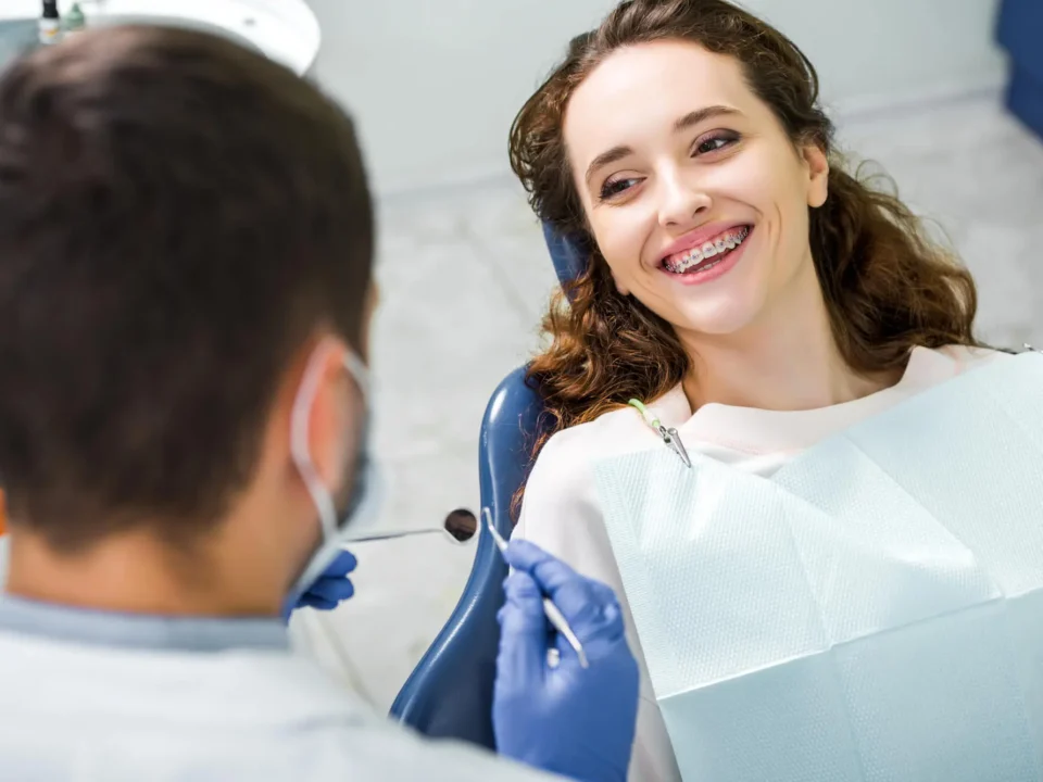 Woman-in-Braces-Visiting-Dentist-Near-Matthews-NC