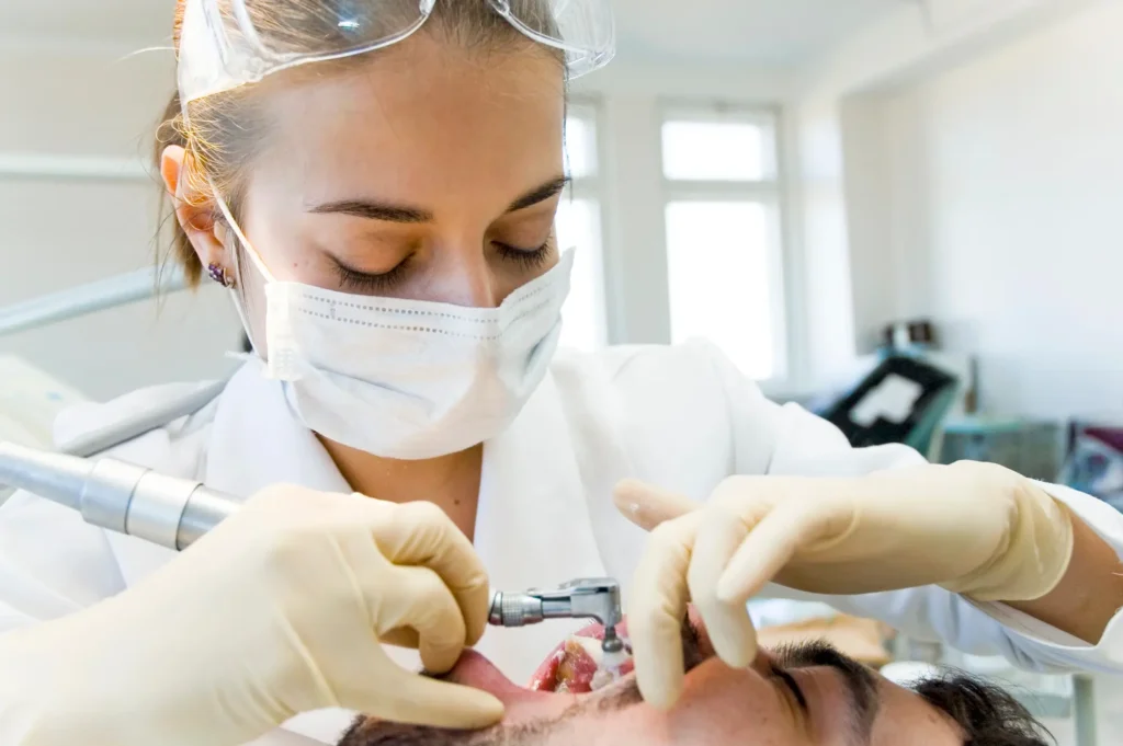 Emergency dentist Matthews NC working with patient in clinic