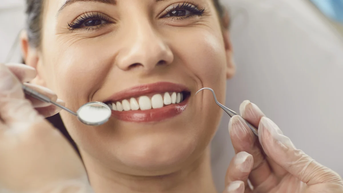 Happy patient after a cosmetic dentist Matthews NC consultation