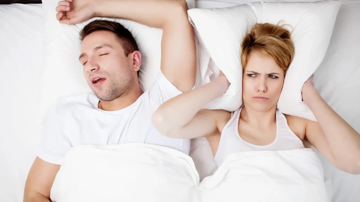 Man sleeping while receiving care from a sleep apnea dentist in Matthews, NC