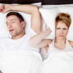 Man sleeping while receiving care from a sleep apnea dentist in Matthews, NC