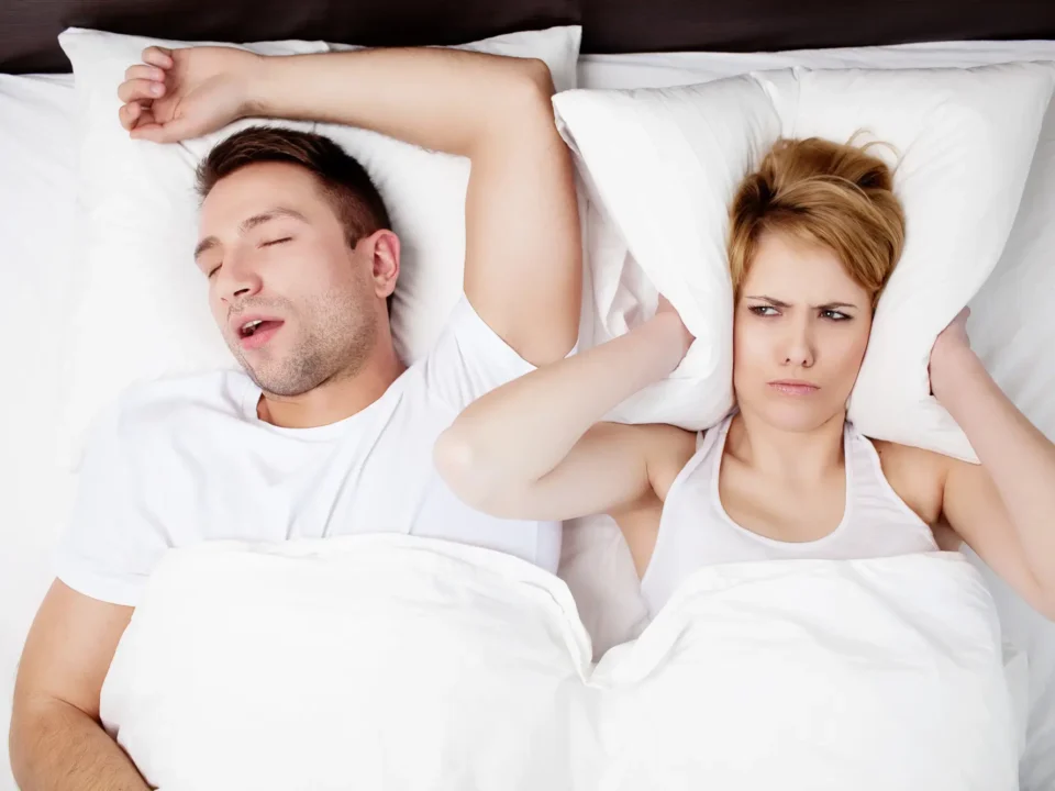 Man sleeping while receiving care from a sleep apnea dentist in Matthews, NC