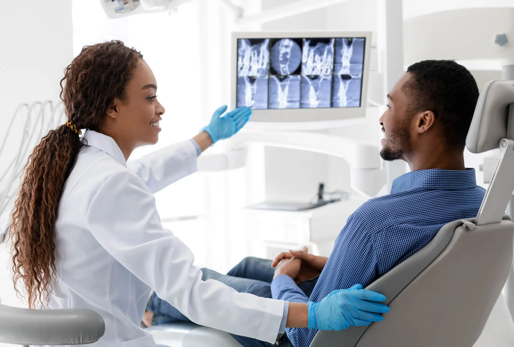 Patient discussing treatment with the best dentist in Matthews, NC